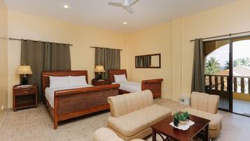 Superior Family Room | Minibar, in-room safe, desk, bed sheets