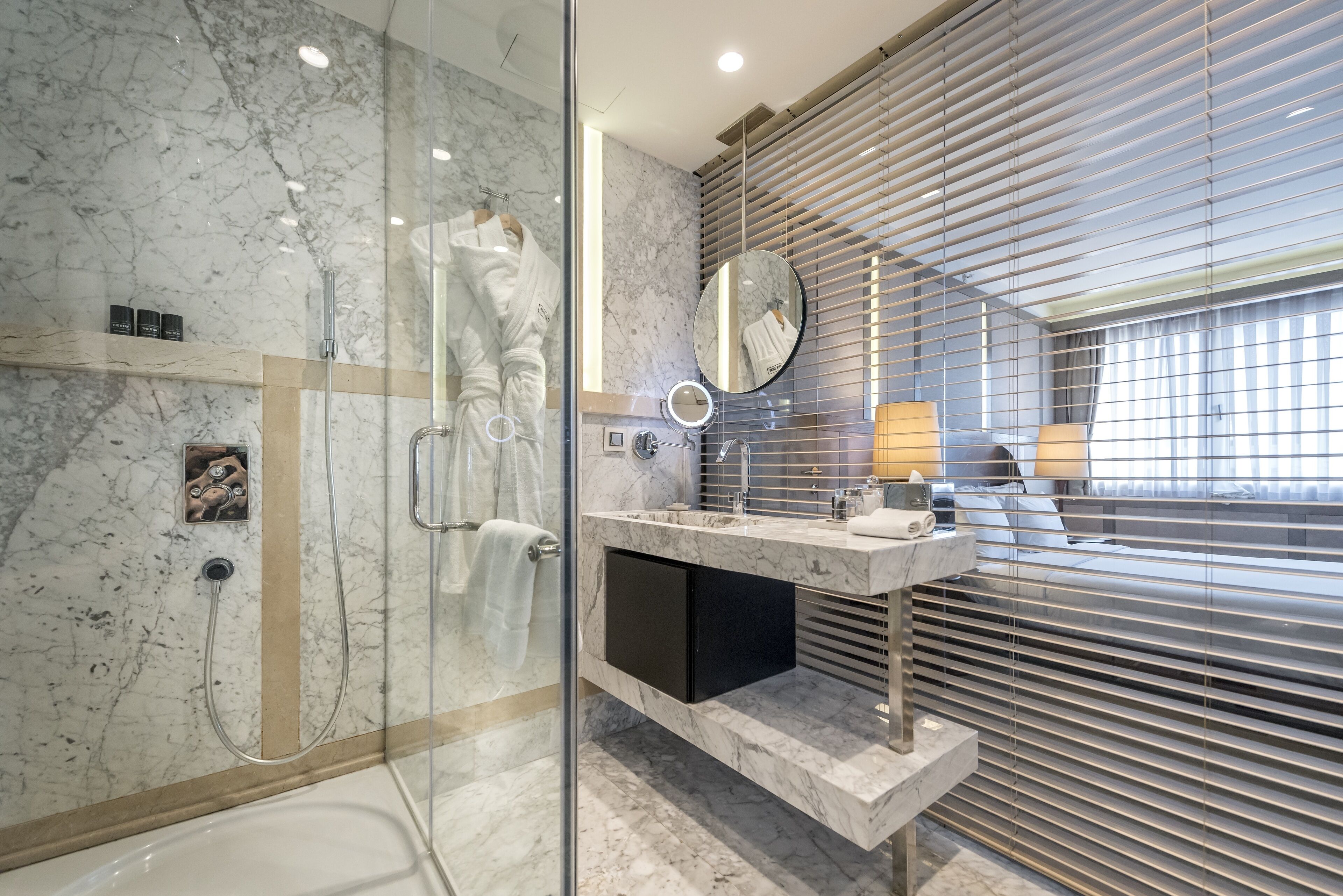 grand superior room | bathroom | shower, rainfall showerhead, designer toiletries, hair dryer