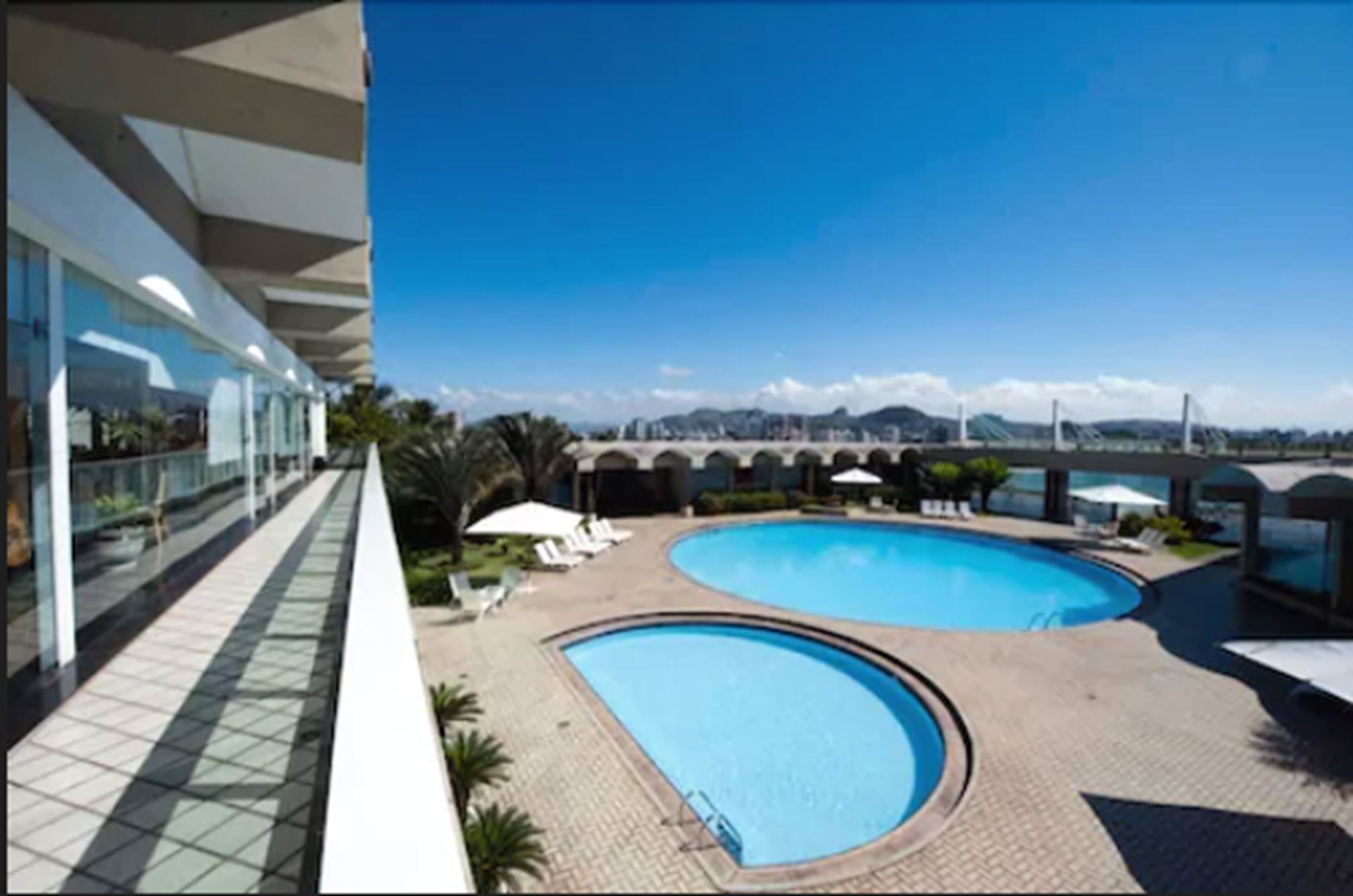 outdoor pool, pool umbrellas, pool loungers