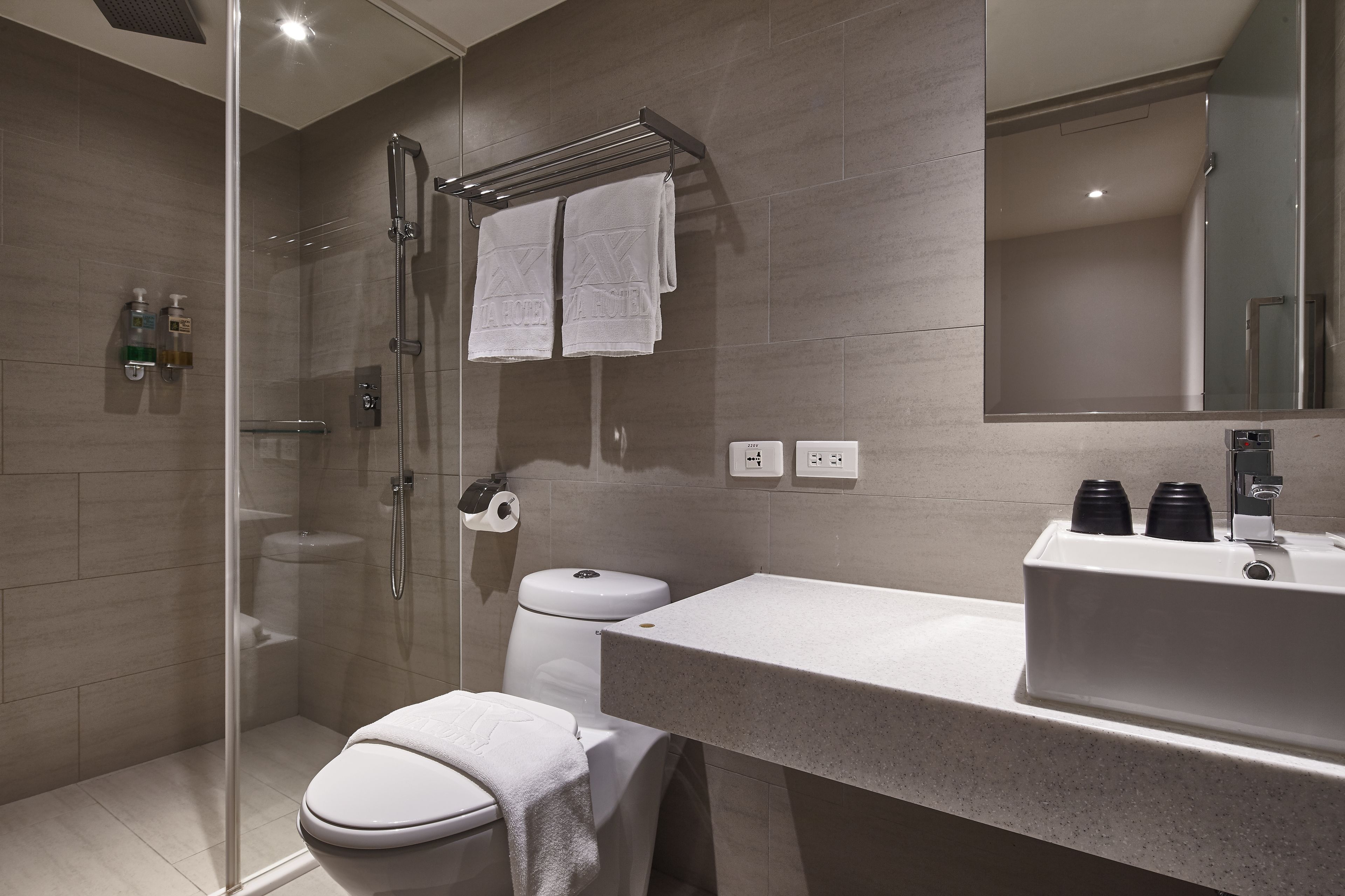 deluxe twin room, 2 double beds, no windows | bathroom | shower, rainfall showerhead, hair dryer, slippers