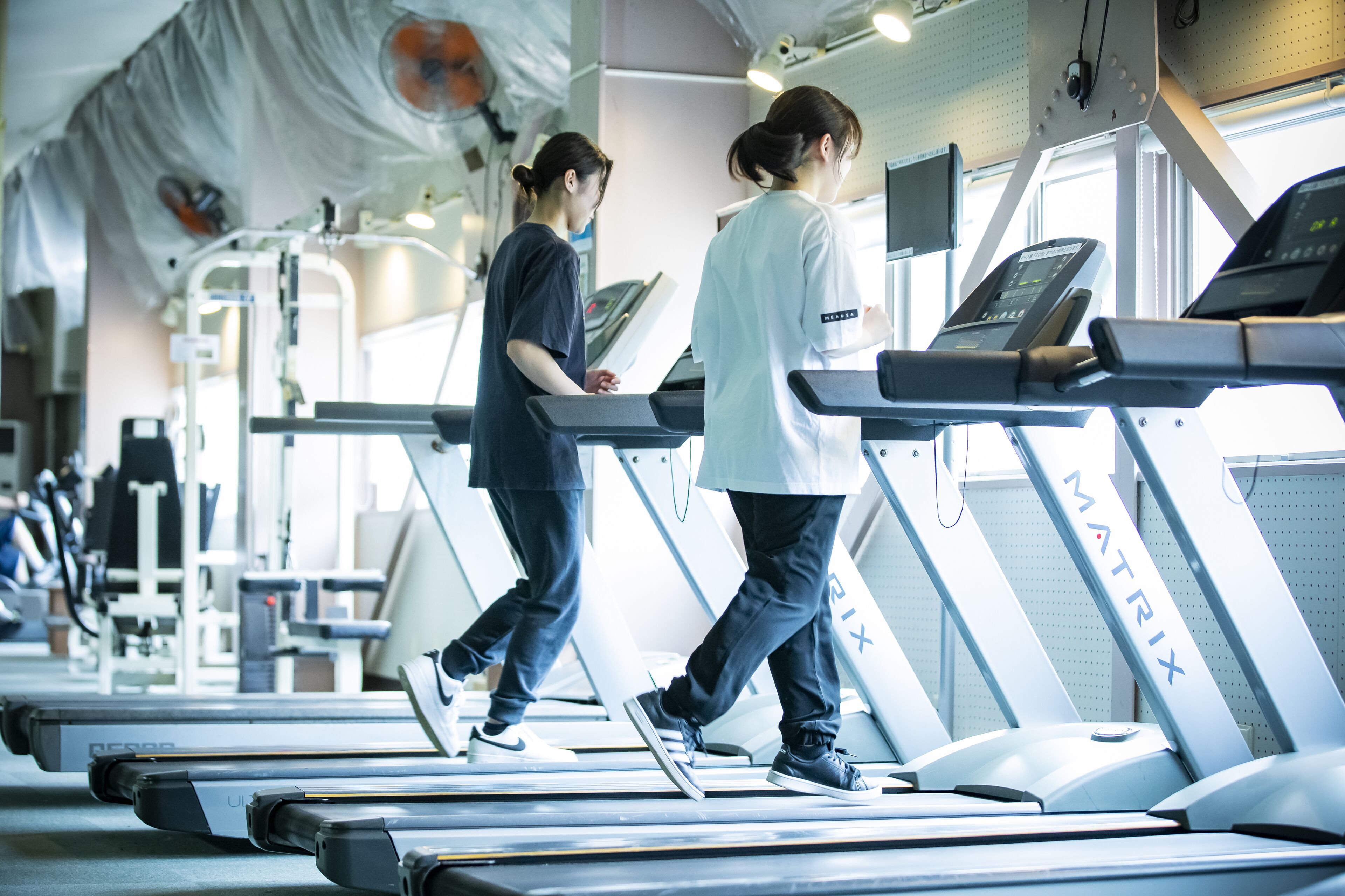 A gym with treadmills and exercise equipment.