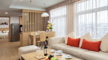 One Bedroom Apartment | Living area | 37-inch LCD TV with cable channels, TV, computer monitors