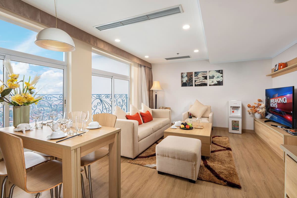 One Bedroom Apartment | Living area | 37-inch LCD TV with cable channels, TV, computer monitors
