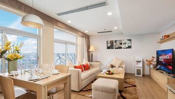 One Bedroom Apartment | Living area | 37-inch LCD TV with cable channels, TV, computer monitors