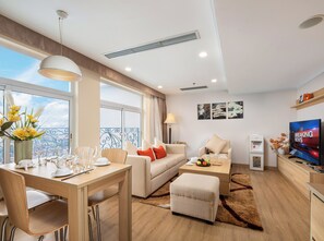 One Bedroom Apartment | Living area | 37-inch LCD TV with cable channels, TV, computer monitors - Super Candle Hotel (Hanoi)