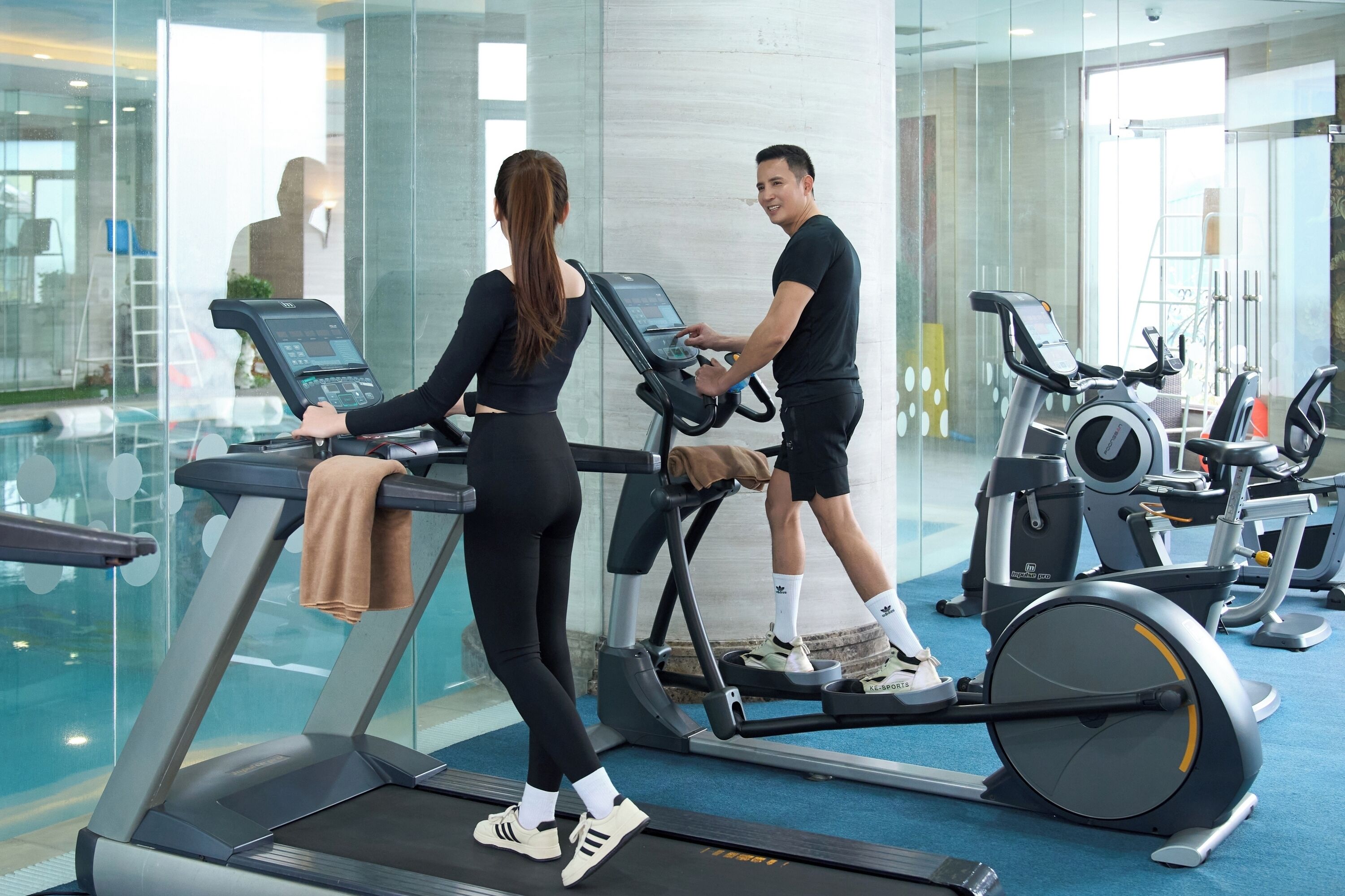 A gym with treadmills and exercise equipment.