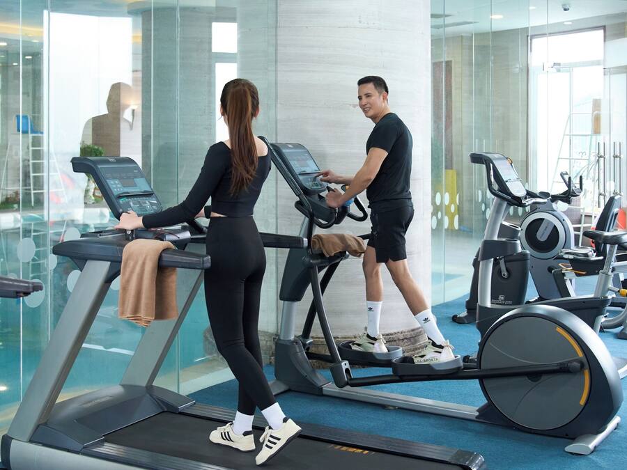 A gym with treadmills and exercise equipment.