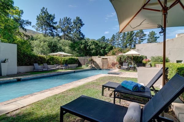 Outdoor pool, pool umbrellas, sun loungers