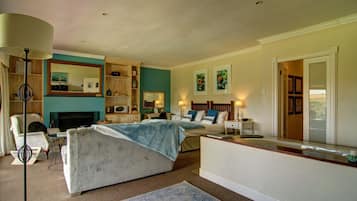 Cozy retreat with a large bed, bedside table, and nightstand, featuring a dresser and mirror.