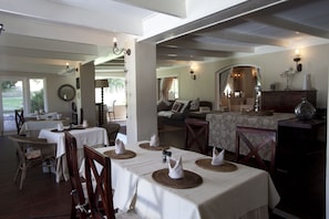 Enjoy meals in a beautifully appointed dining area with comfortable seating and elegant table settings.