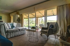 Manor House Honeymoon Suite | Living area | Flat-screen TV, DVD player