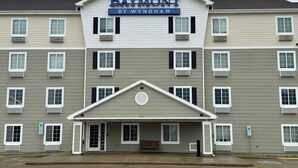 A multi-story hotel with a prominent "Baymont by Wyndham" sign. - Baymont by Wyndham Dickinson (Dickinson)