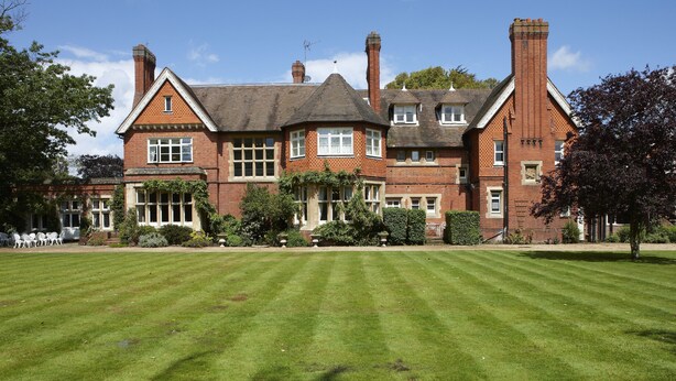 A large, traditional brick building with multiple windows and a well-maintained lawn in front. - Cantley House Hotel (Wokingham)