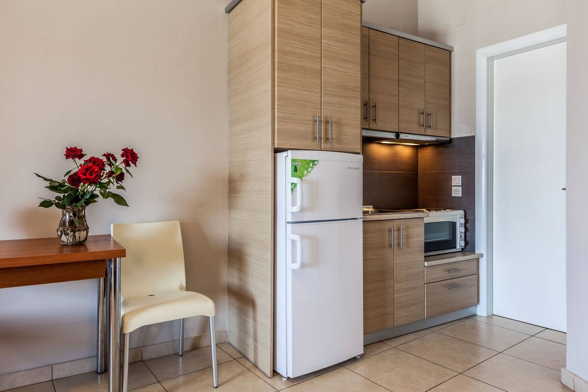 Family Apartment, Partial Lake View | Private kitchen | Fridge, oven, stovetop, highchair