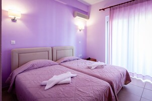 Apartamento familiar, vistas al mar | Sábanas de algodón egipcio y ropa de cama de alta calidad