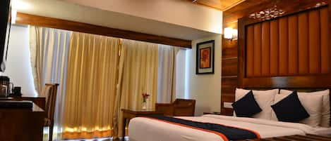 Executive Room | Pillow-top beds, in-room safe, individually decorated