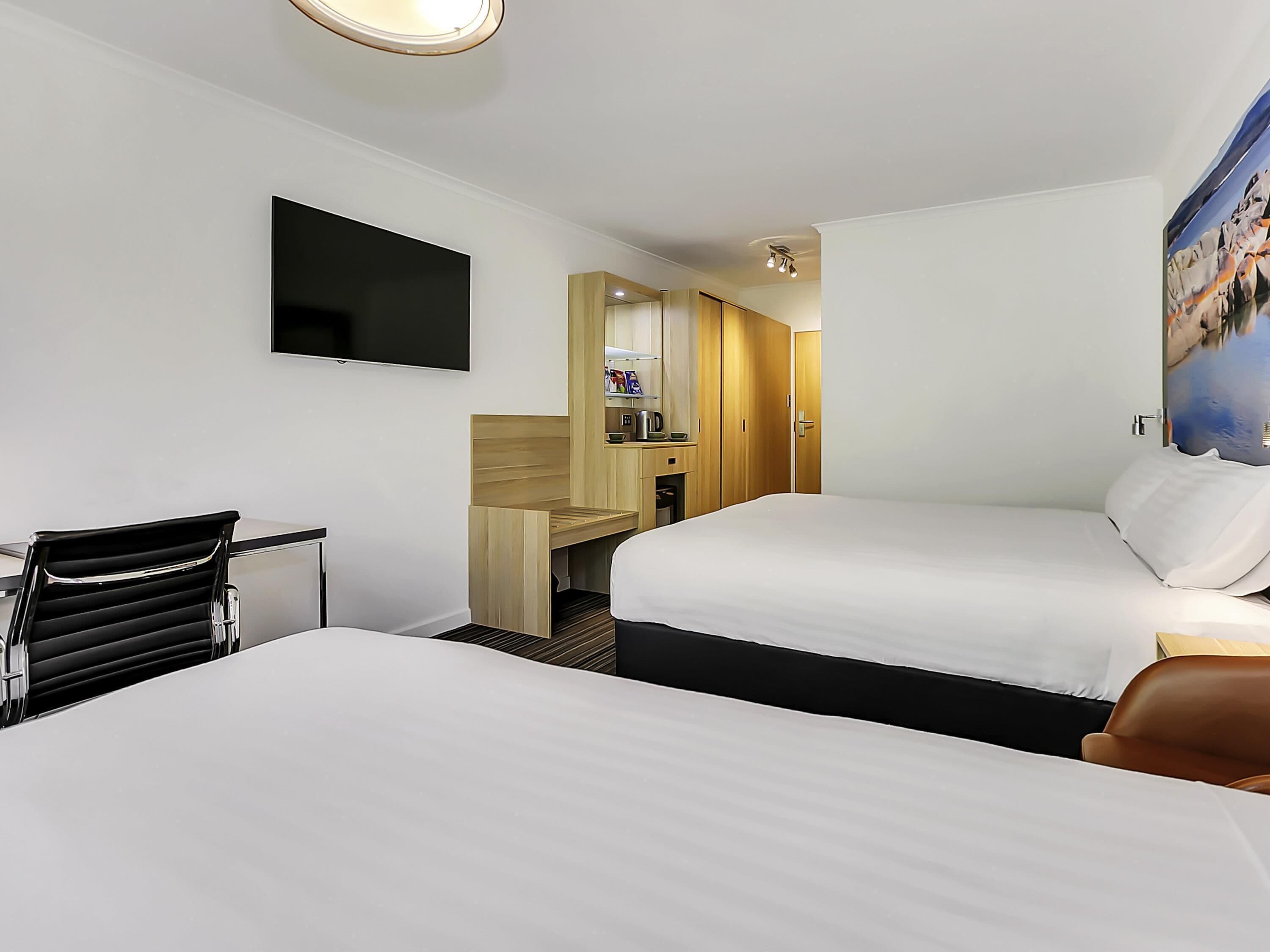 Deluxe Room, Multiple Beds | Premium bedding, down comforters, minibar, desk