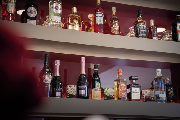 Shelves of various liquor bottles. - Phoenicia Comfort Hotel (Bucharest)