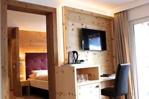 Junior Suite | Minibar, in-room safe, individually decorated, desk - Hotel Conrad (Scuol)
