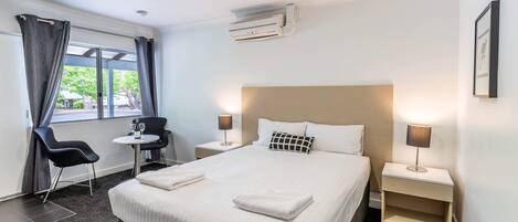 Deluxe Room, 1 Queen Bed | Desk, blackout drapes, iron/ironing board, free cribs/infant beds