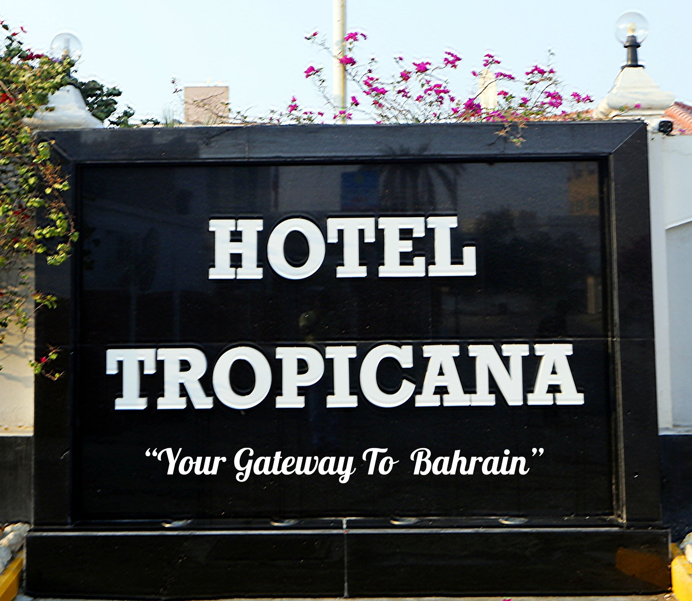 A sign for the Hotel Tropicana with the tagline "Your Gateway To Bahrain".