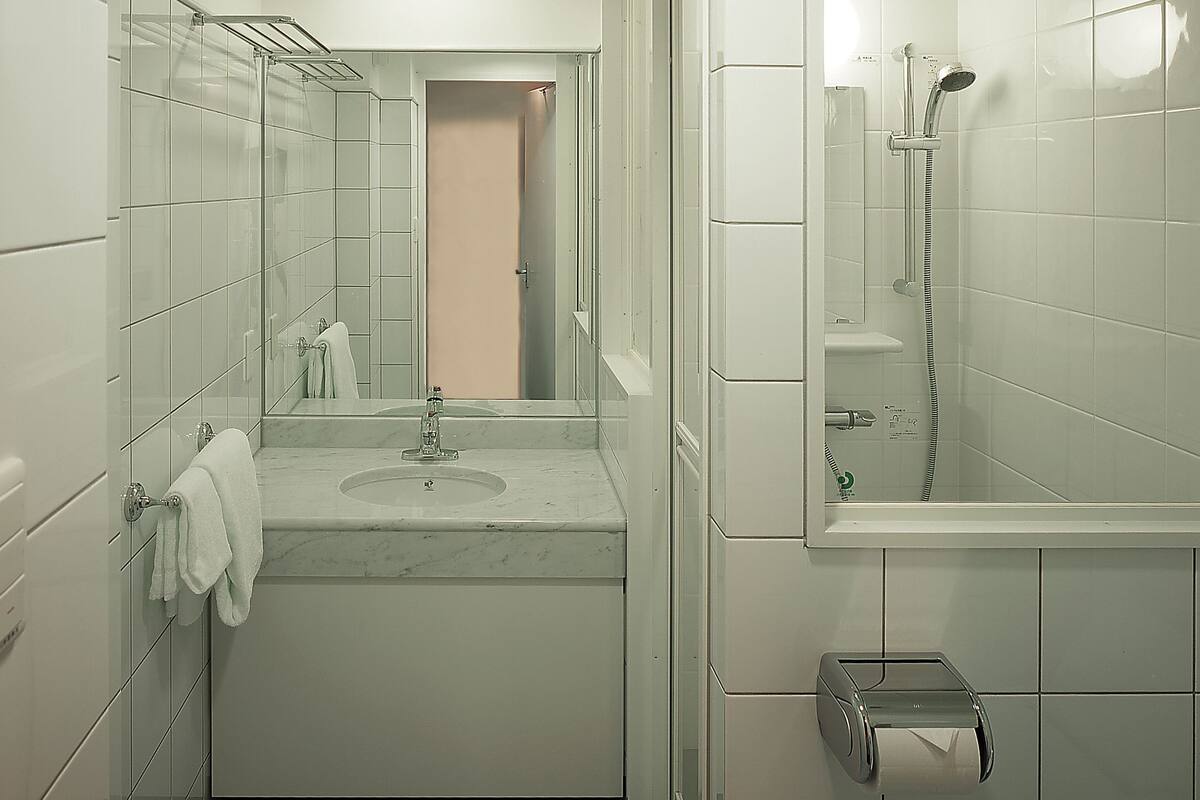 desk, laptop workspace, blackout curtains, iron/ironing board