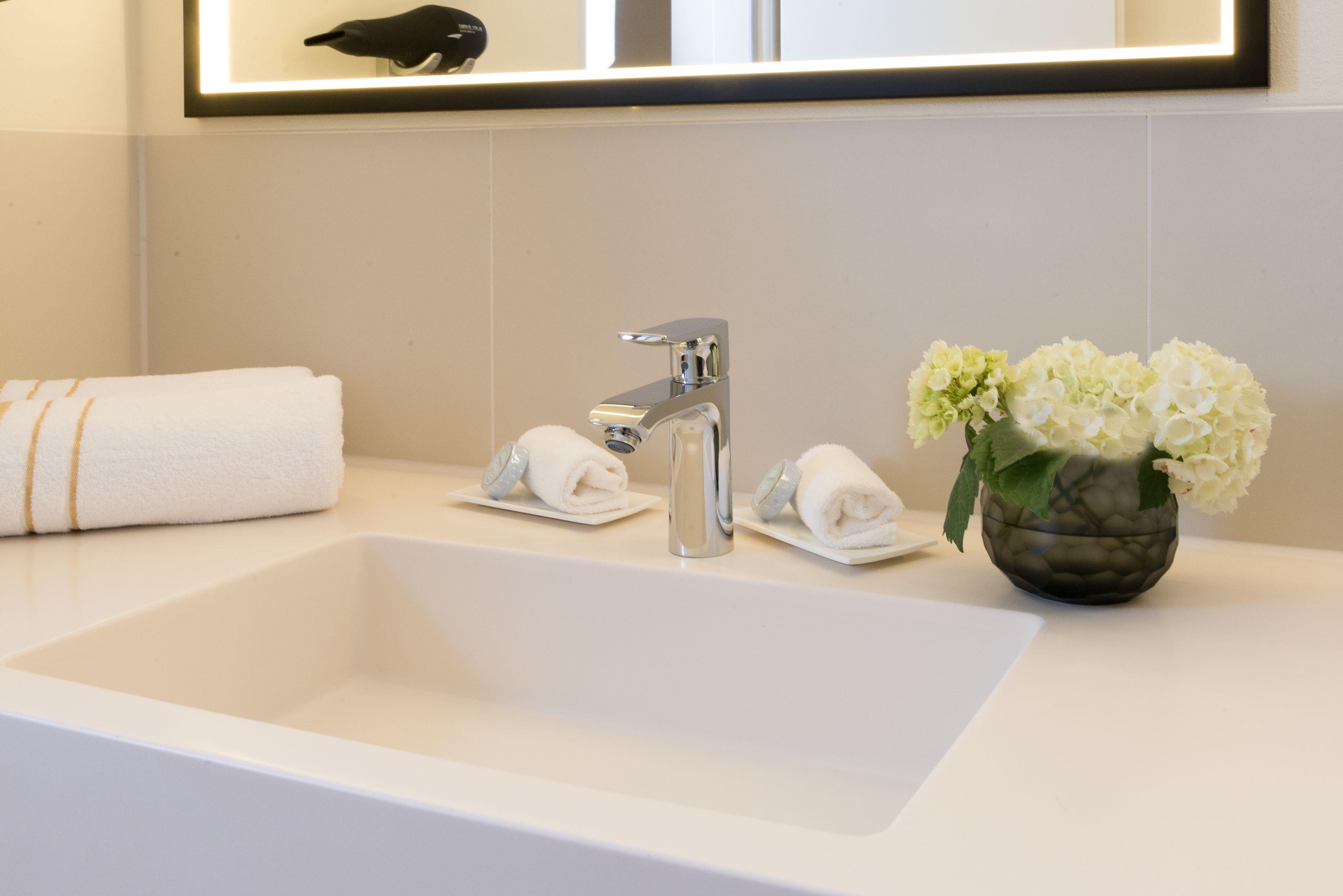 designer toiletries, hair dryer, bathrobes, slippers