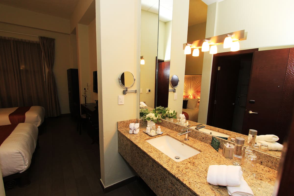 deluxe room, 2 double beds | bathroom amenities | shower, rainfall showerhead, free toiletries, hair dryer