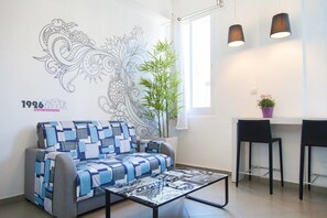 Studio - Double (Stairs Access) | Living area | 32-inch TV with satellite channels - 1926 Designed Apartments Hotel (Haifa)