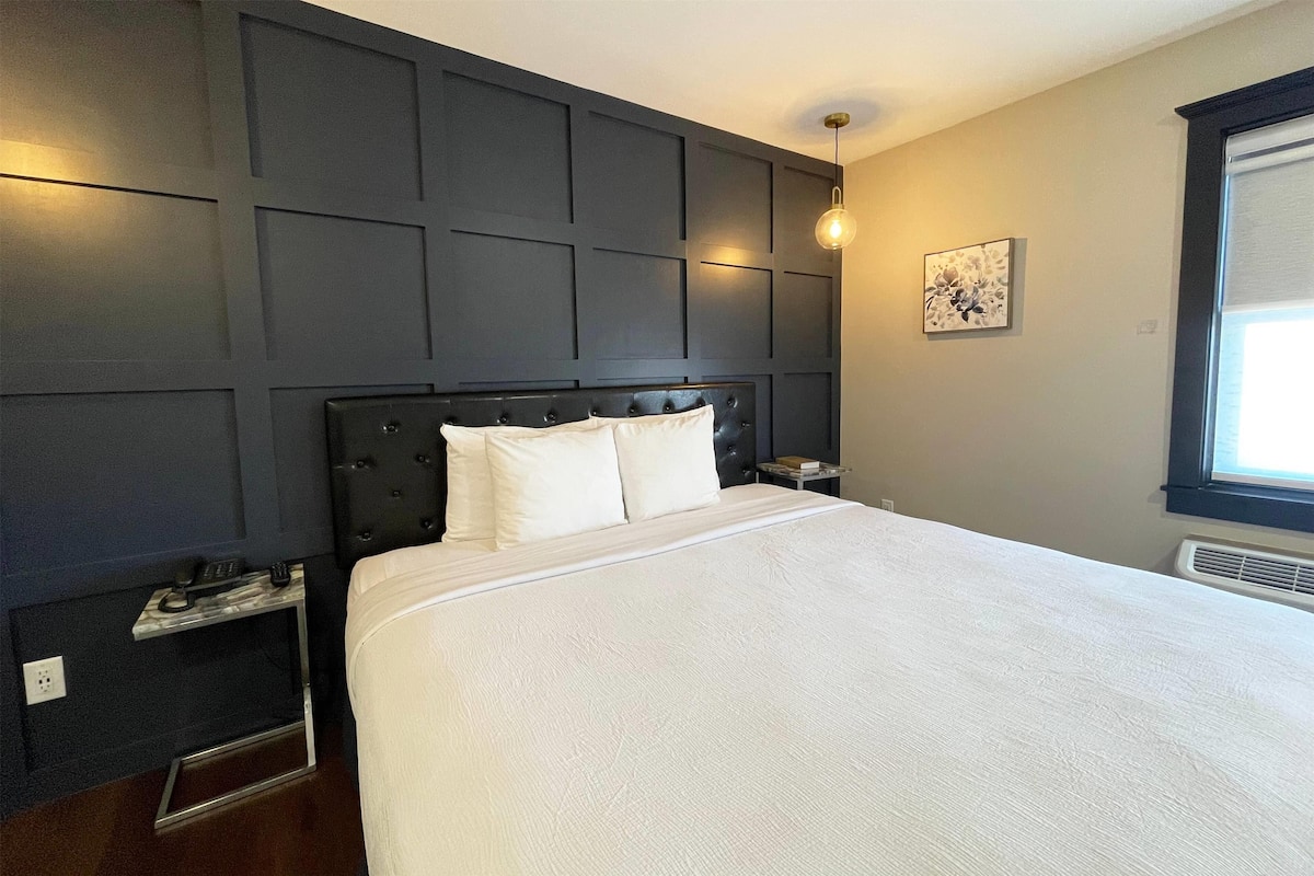 Superior Studio Suite, 1 King Bed, Non Smoking | 1 bedroom, laptop workspace, blackout drapes, iron/ironing board