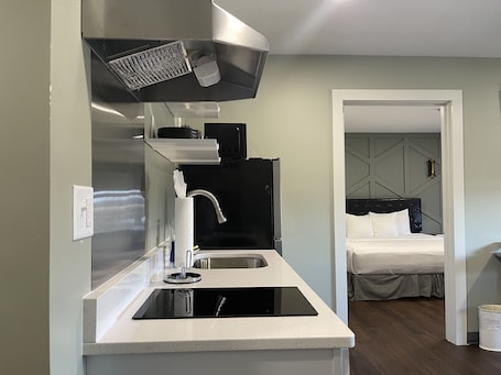 Premium Suite, 1 King Bed with Sofa bed | Private kitchen | Mini-fridge, cleaning supplies, paper towels. Chateau Hotel and Conference Center