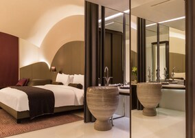 Premium bedding, down comforters, minibar, in-room safe