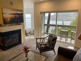 Premier Condo, 2 Bedrooms, Ocean View | Living area | 50-inch flat-screen TV with cable channels, TV, fireplace