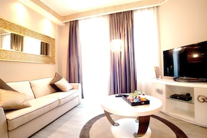 Junior Suite, Kitchenette | Living area | Flat-screen TV, first-run movies
