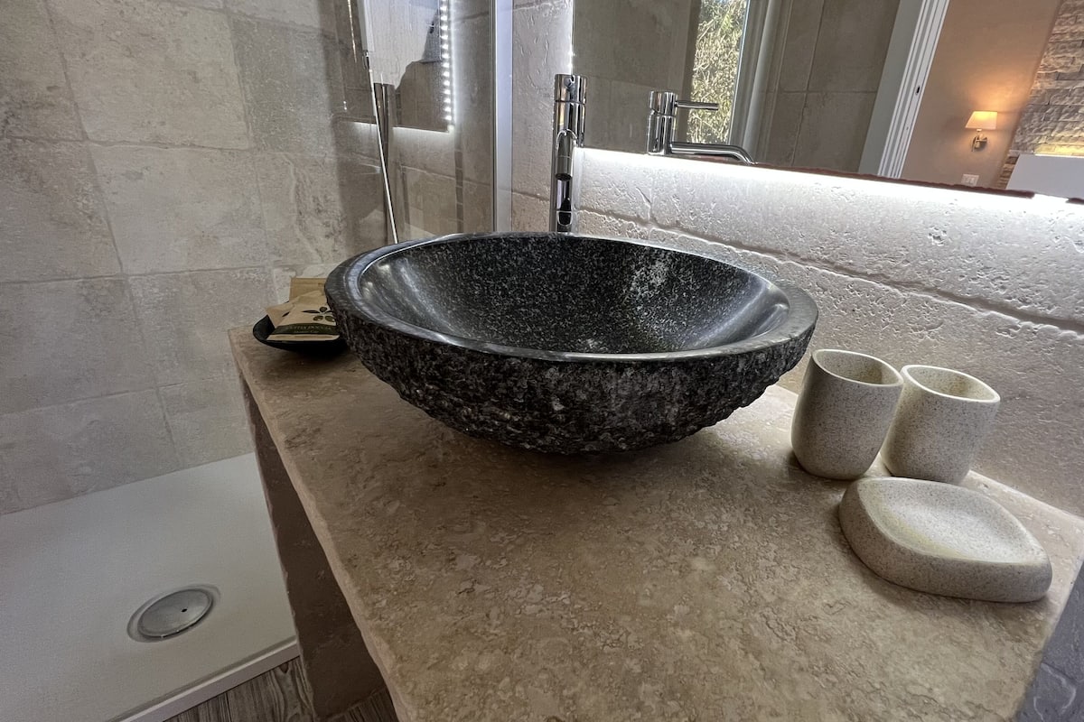 luxury double room | bathroom | shower, rainfall showerhead, hair dryer, towels