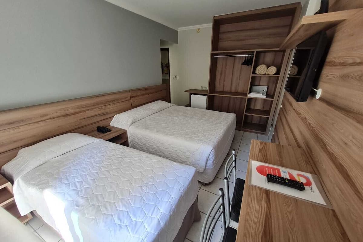 Superior Triple Room | Minibar, in-room safe, desk, laptop workspace