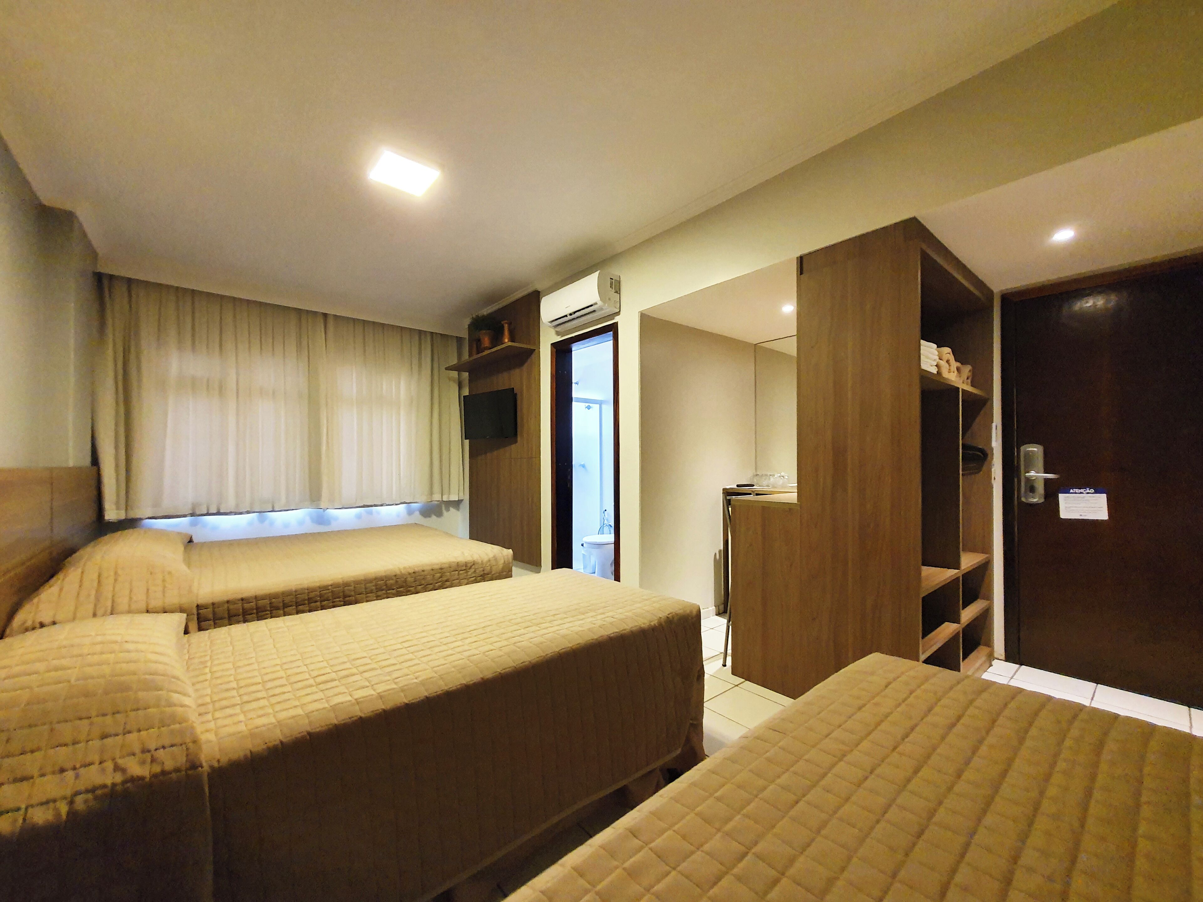 superior quadruple room | minibar, in-room safe, desk, laptop workspace