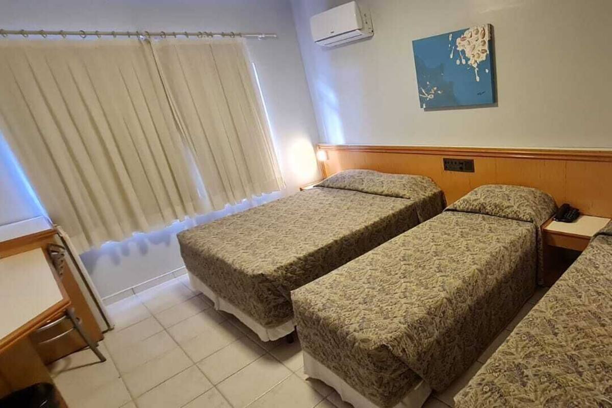 Standard Quadruple Room | Minibar, in-room safe, desk, laptop workspace