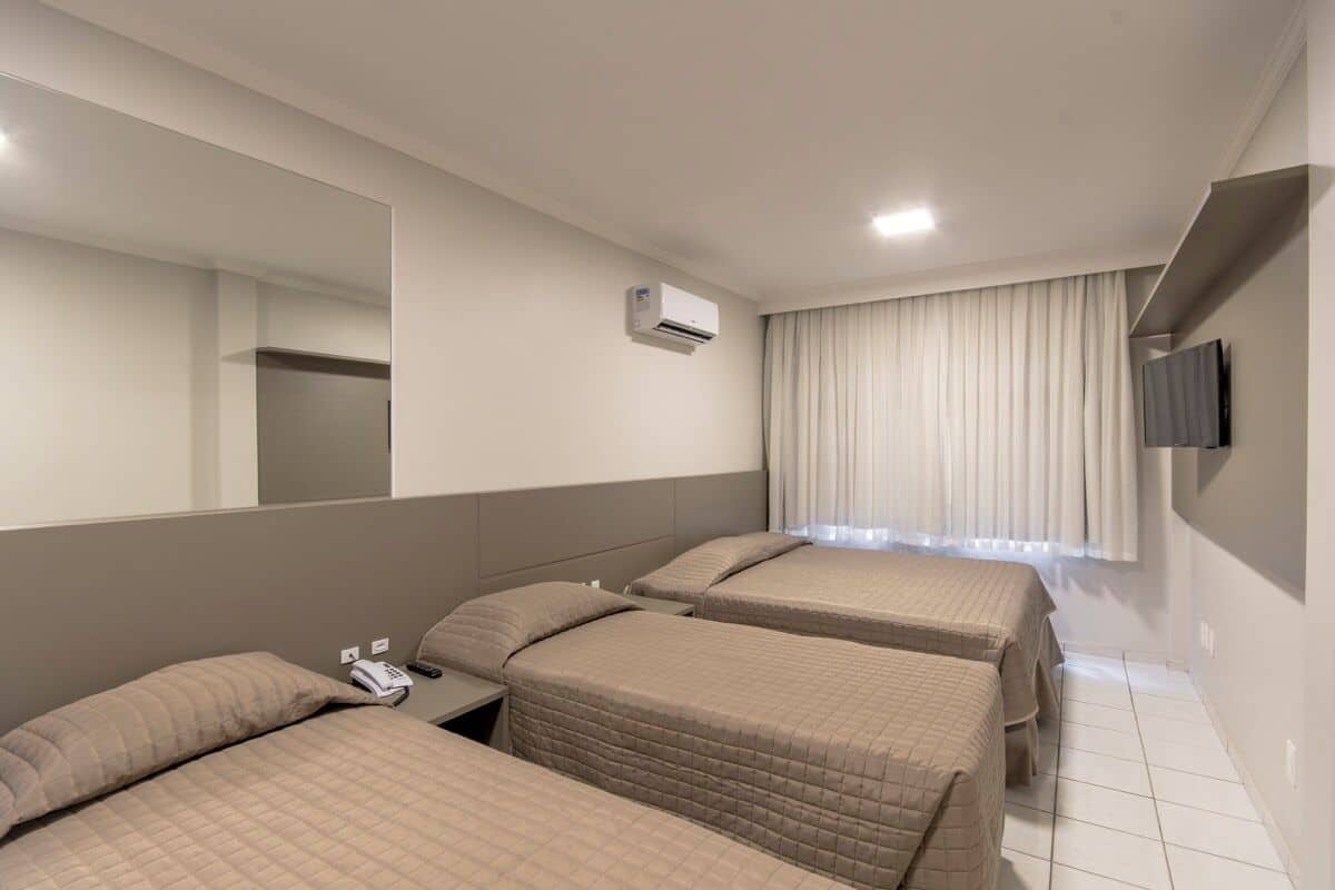 Superior Quadruple Room | Minibar, in-room safe, desk, laptop workspace