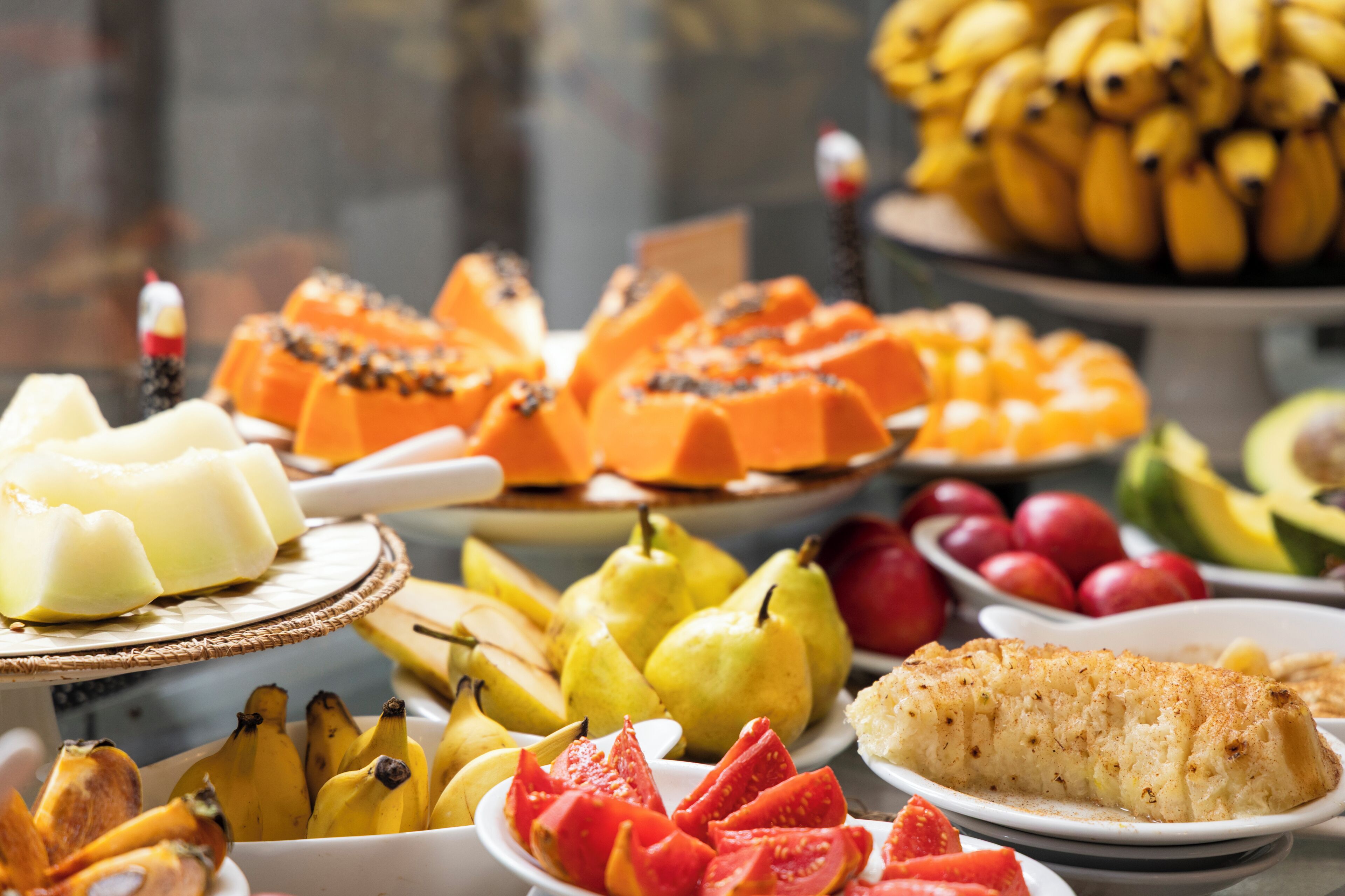 A variety of fruits and desserts on a table.