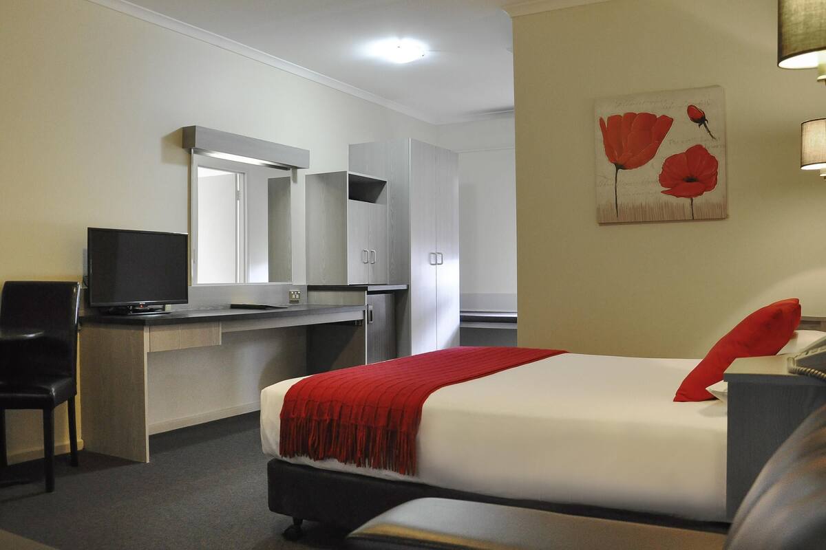 Minibar, desk, blackout curtains, iron/ironing board