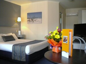 Minibar, desk, blackout curtains, iron/ironing board