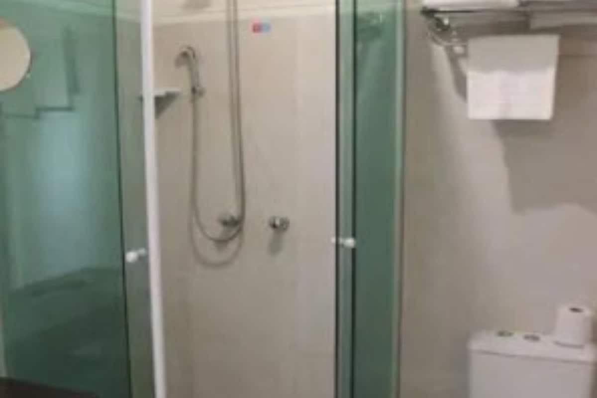 deluxe room | bathroom | shower, free toiletries, hair dryer, bathrobes