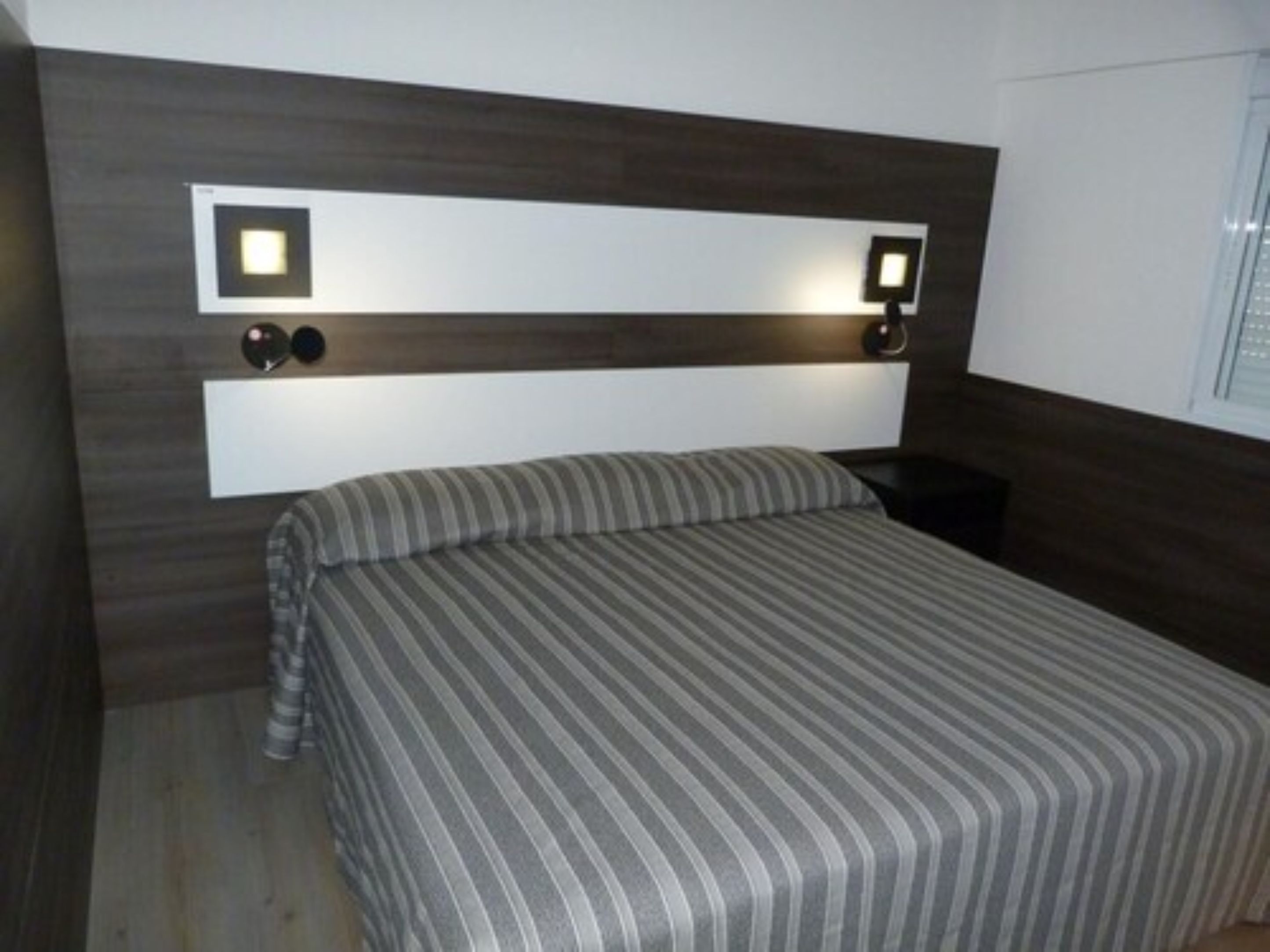 deluxe room | minibar, in-room safe, desk, blackout curtains