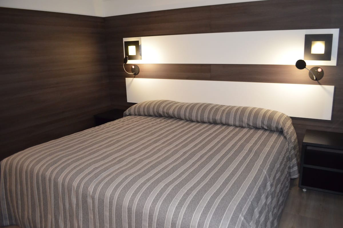 deluxe room | minibar, in-room safe, desk, blackout curtains