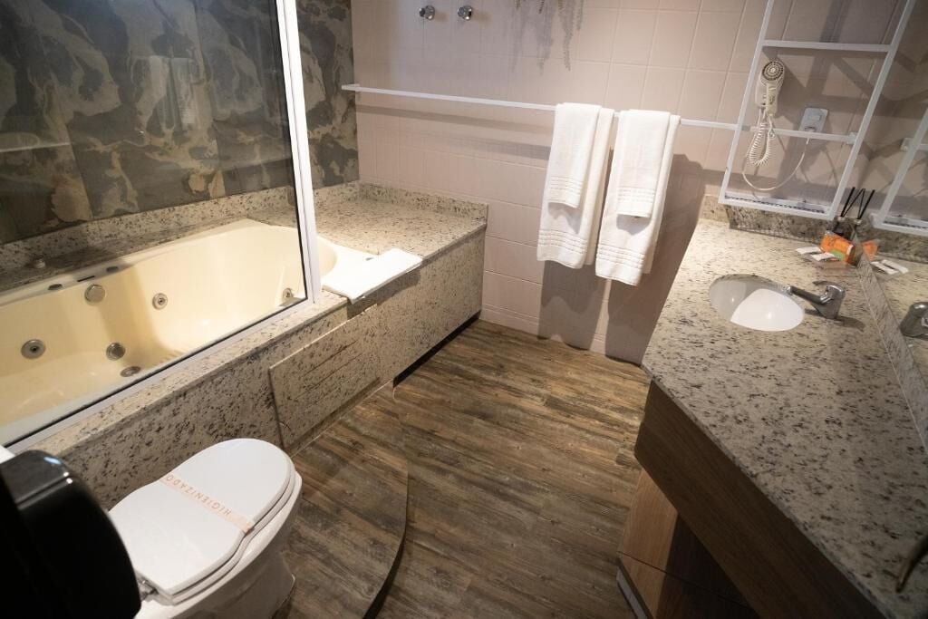 premium suite | bathroom | shower, free toiletries, hair dryer, towels