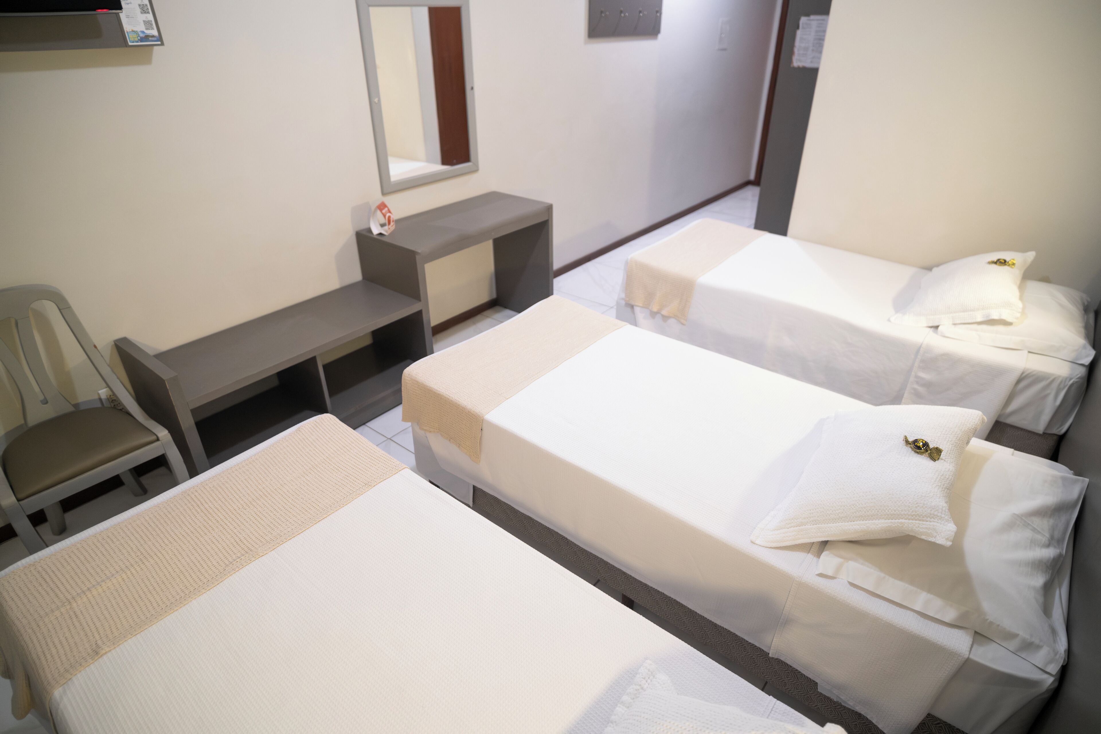 standard triple room | 1 bedroom, minibar, in-room safe, individually furnished