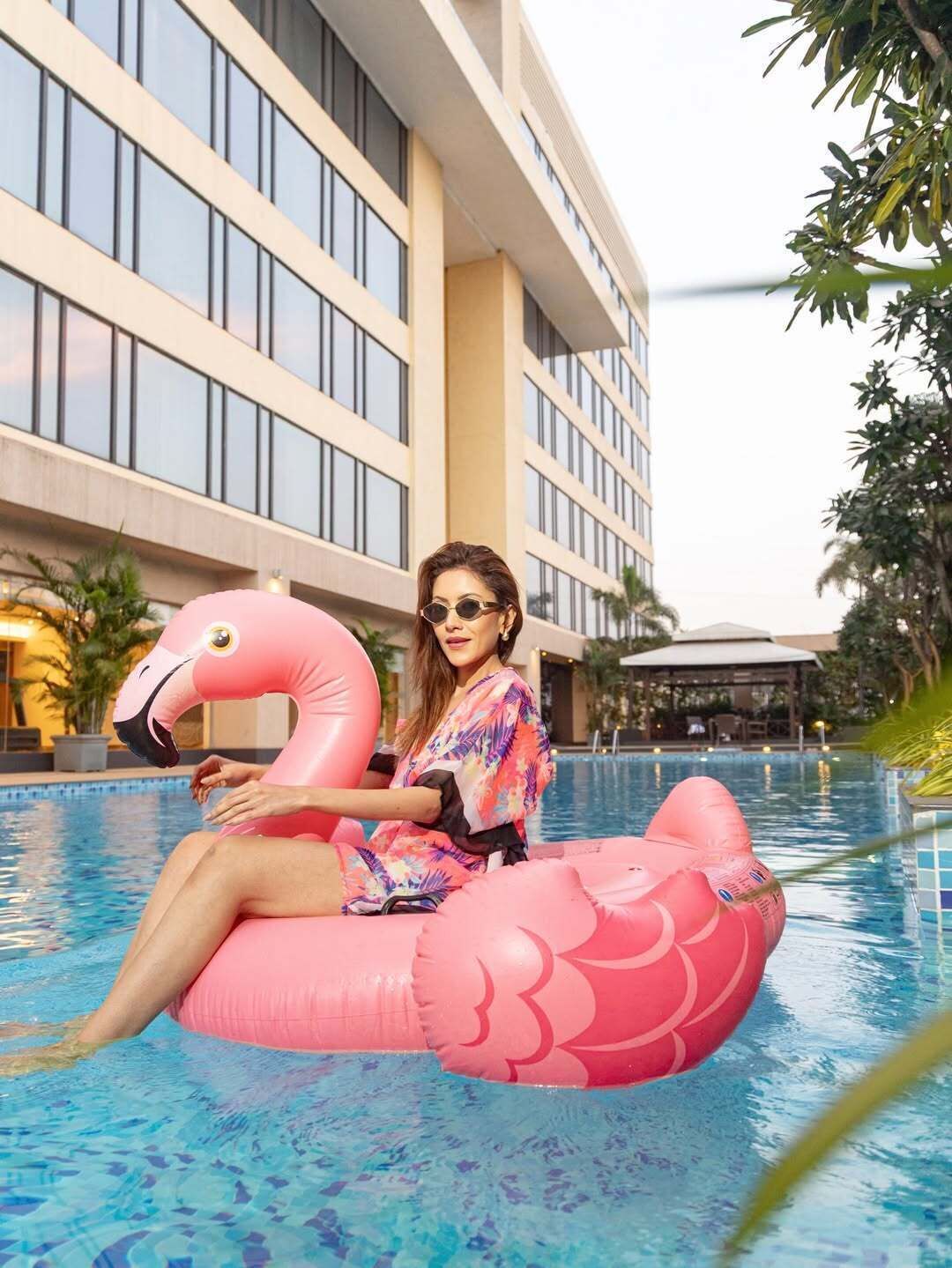 Outdoor pool, open 6:00 AM to 10:00 PM, pool umbrellas, pool loungers