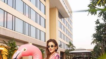 Outdoor pool, open 6:00 AM to 10:00 PM, pool umbrellas, pool loungers