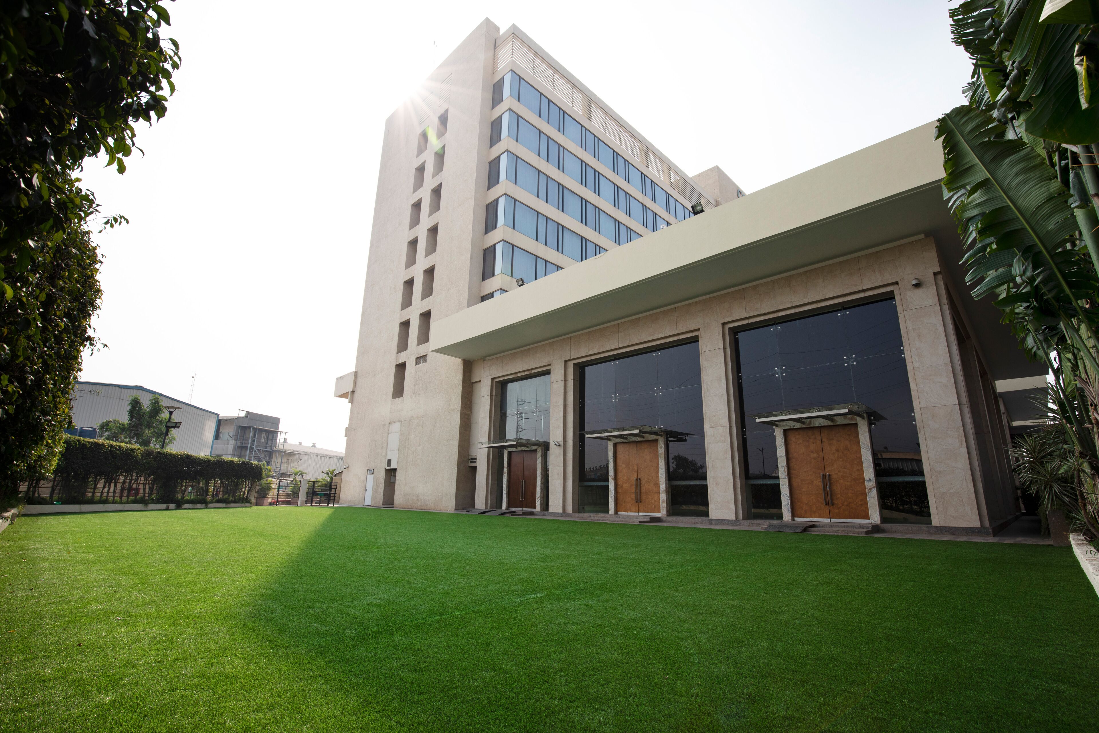A modern building with large glass windows and a flat roof.